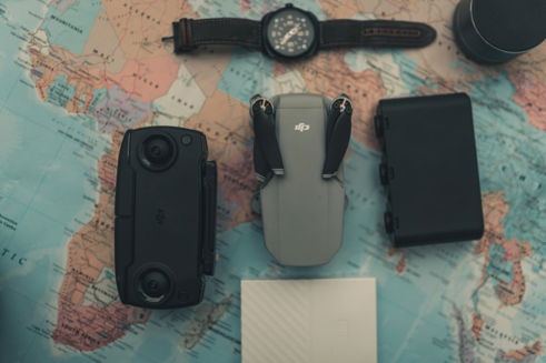 a-map-with-a-watch--camera--and-other-items-on-it.jpg a map with a watch, camera, and other items on it